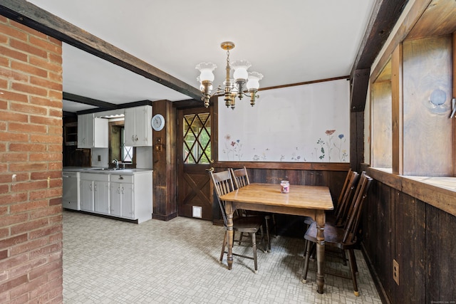 905 Meriden Ave, Southington, CT 06489 - dining room featuring a chandelier, a wainscoted wall, wood walls, and beamed ceiling