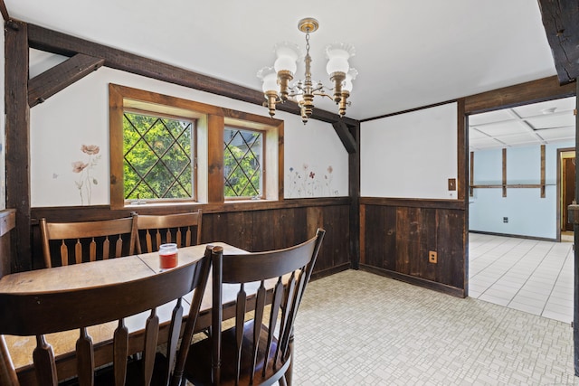 905 Meriden Ave, Southington, CT 06489 - dining space with a chandelier, a wainscoted wall, and wood walls