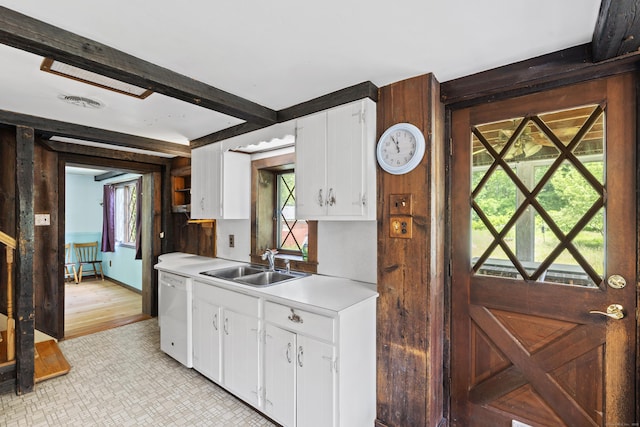905 Meriden Ave, Southington, CT 06489 - kitchen with dishwasher, light countertops, white cabinetry, and plenty of natural light