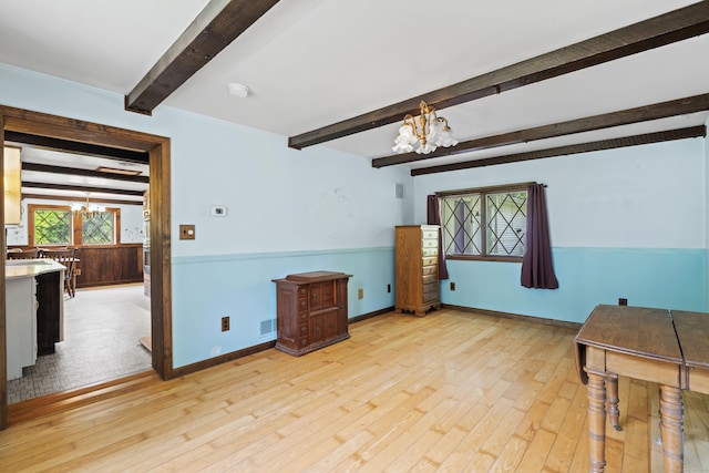 905 Meriden Ave, Southington, CT 06489 - unfurnished living room with a chandelier, beam ceiling, and light wood finished floors