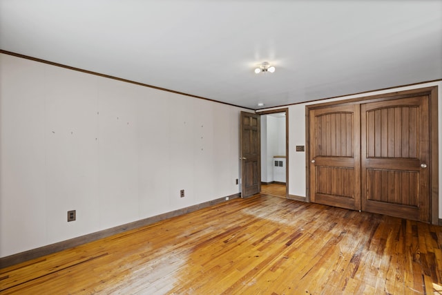 905 Meriden Ave, Southington, CT 06489 - unfurnished bedroom featuring light wood finished floors and crown molding