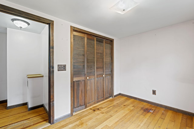 905 Meriden Ave, Southington, CT 06489 - unfurnished bedroom with light wood finished floors and a closet