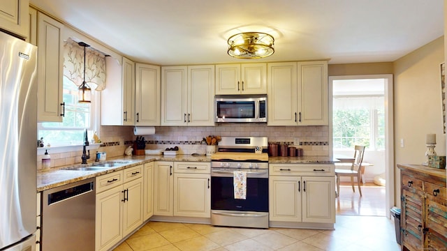 3 Lower Lake Rd, Danbury, CT 06811 - kitchen with stainless steel appliances, tasteful backsplash, plenty of natural light, and light stone countertops