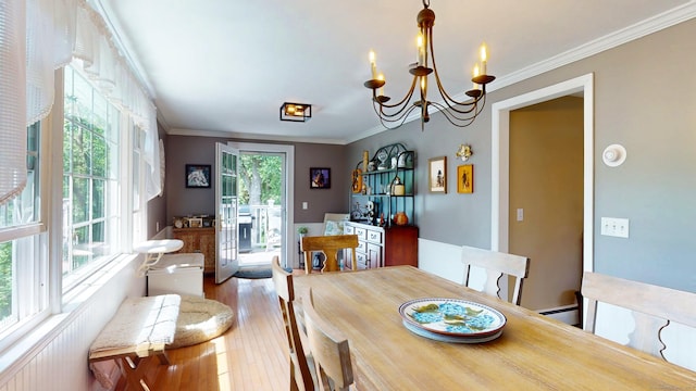3 Lower Lake Rd, Danbury, CT 06811 - dining space with a chandelier, ornamental molding, wood finished floors, and a baseboard radiator