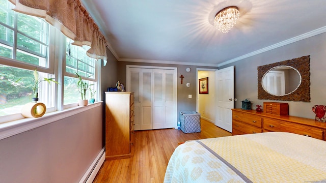 3 Lower Lake Rd, Danbury, CT 06811 - bedroom featuring ornamental molding, light wood-type flooring, a closet, and a chandelier
