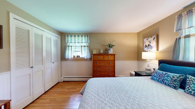 3 Lower Lake Rd, Danbury, CT 06811 - bedroom with a baseboard heating unit, wainscoting, wood finished floors, and a closet
