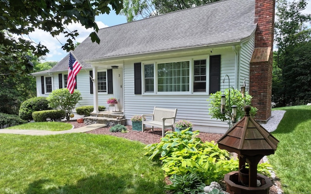 3 Lower Lake Rd, Danbury, CT 06811 - view of front facade with a chimney, a front yard, and a shingled roof
