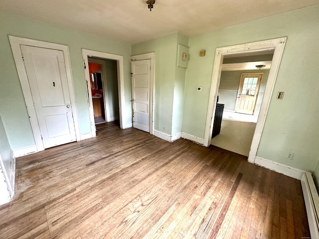 155 Waverly Rd, Shelton, CT 06484 - unfurnished bedroom with hardwood / wood-style flooring and baseboard heating