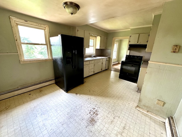 155 Waverly Rd, Shelton, CT 06484 - kitchen with black appliances, under cabinet range hood, baseboard heating, light countertops, and light flooring