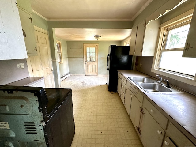 155 Waverly Rd, Shelton, CT 06484 - kitchen with light flooring, a baseboard radiator, crown molding, black fridge, and range