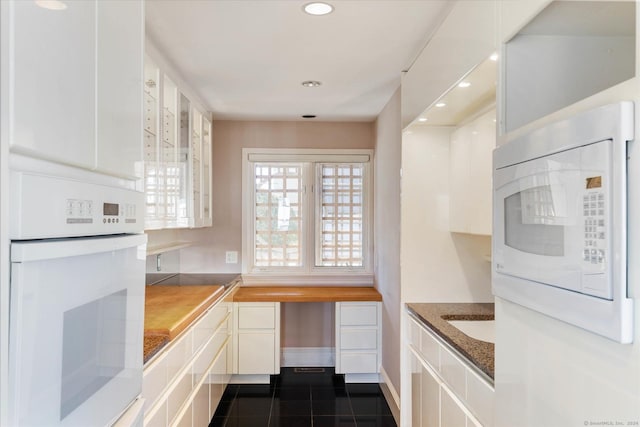 33 Palmer Rd, Waterford, CT 06385 - kitchen featuring white appliances, white cabinetry, recessed lighting, glass insert cabinets, and dark tile patterned floors