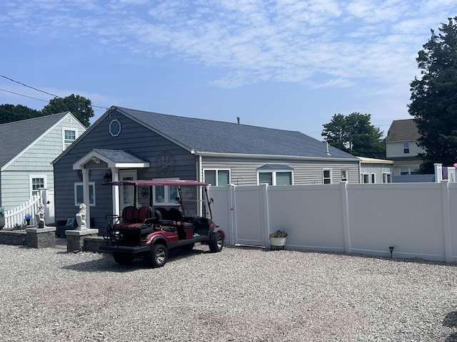 12 Bellaire Dr, Old Saybrook, CT 06475 - rear view of house with a shingled roof