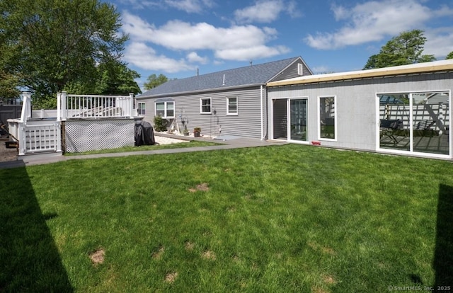 12 Bellaire Dr, Old Saybrook, CT 06475 - rear view of property with a yard and a wooden deck