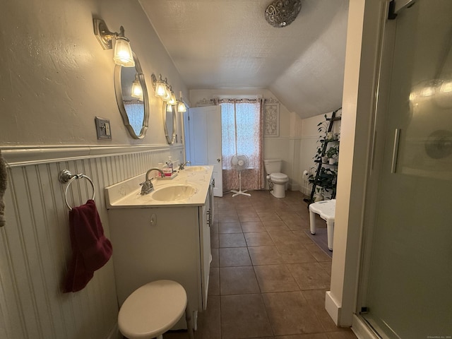 352 Church St, Putnam, CT 06260 - full bath featuring vaulted ceiling, a textured ceiling, a shower stall, tile patterned flooring, and double vanity
