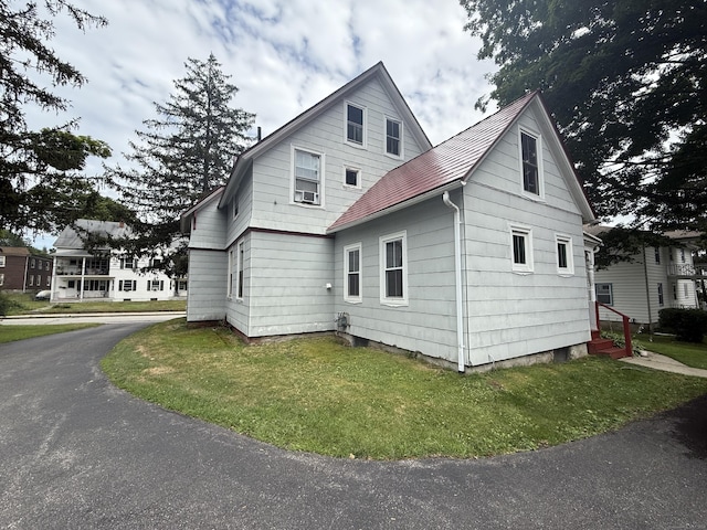 352 Church St, Putnam, CT 06260 - view of home's exterior with a lawn