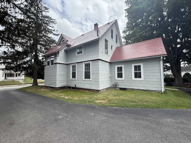 352 Church St, Putnam, CT 06260 - view of side of home featuring a chimney and a lawn