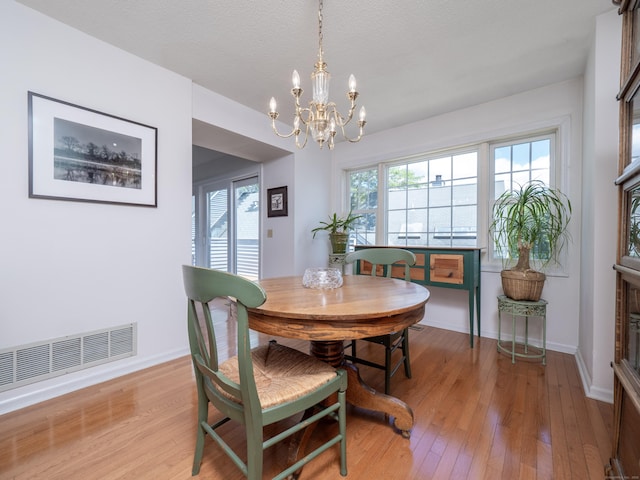 26 Wilton Crst Unit 26, Wilton, CT 06897 - dining area featuring a chandelier and light wood-style floors