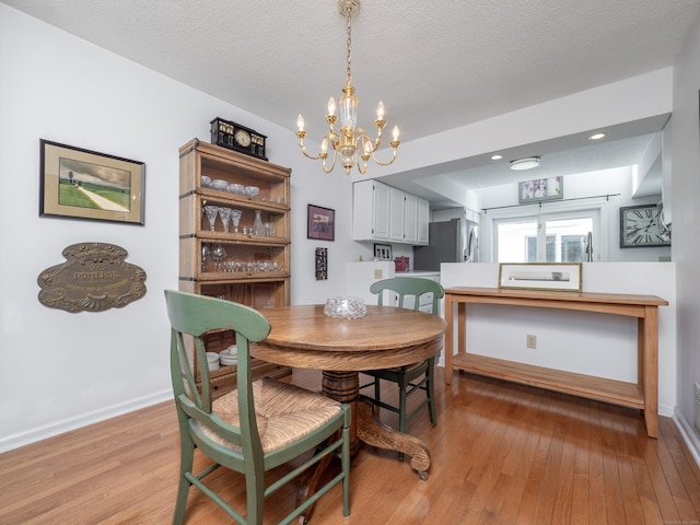 26 Wilton Crst Unit 26, Wilton, CT 06897 - dining area with a chandelier and light wood finished floors