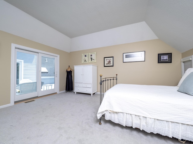 26 Wilton Crst Unit 26, Wilton, CT 06897 - bedroom featuring vaulted ceiling, access to exterior, and light colored carpet