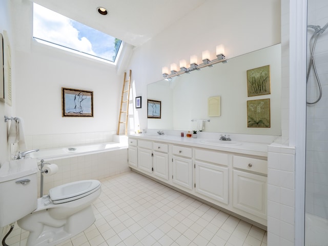 26 Wilton Crst Unit 26, Wilton, CT 06897 - bathroom with a skylight, tile patterned flooring, double vanity, a relaxing tiled tub, and tiled shower