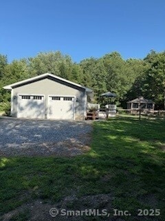 1 Brookfield Rd, Harwinton, CT 06791 - detached garage with a view of trees