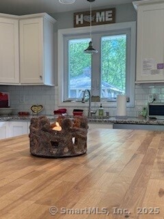 1 Brookfield Rd, Harwinton, CT 06791 - kitchen with white cabinetry, decorative backsplash, wood finished floors, butcher block countertops, and pendant lighting