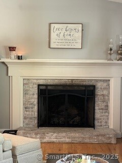 1 Brookfield Rd, Harwinton, CT 06791 - detailed view of a fireplace with raised hearth and wood finished floors