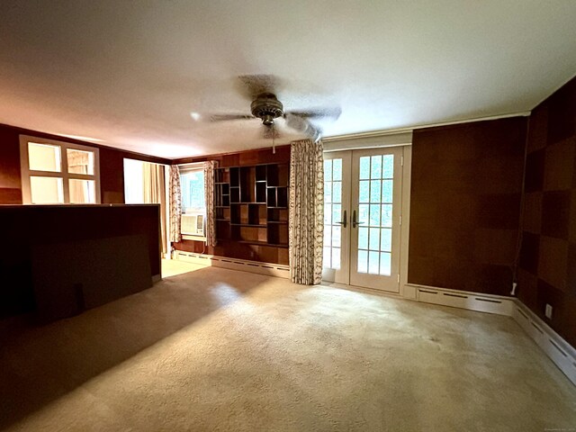 23 S Elm St, Windsor Locks, CT 06096 - unfurnished living room with french doors, ceiling fan, a baseboard radiator, carpet, and cooling unit