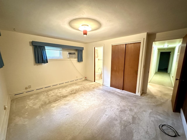 23 S Elm St, Windsor Locks, CT 06096 - unfurnished bedroom with a baseboard radiator, light carpet, a closet, ensuite bathroom, and a wall mounted AC