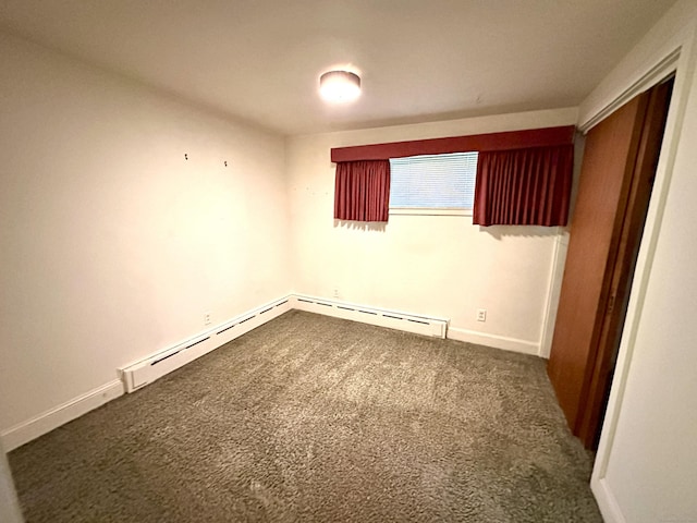 23 S Elm St, Windsor Locks, CT 06096 - spare room with dark colored carpet and a baseboard heating unit