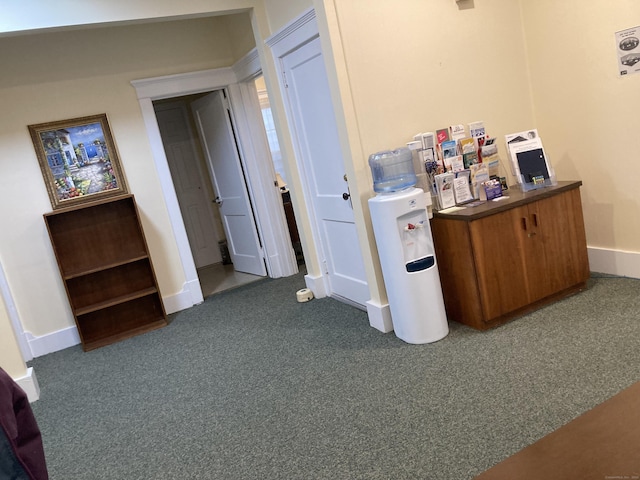 21 Chicago Ave, Groton, CT 06340 - hall featuring dark colored carpet and baseboards