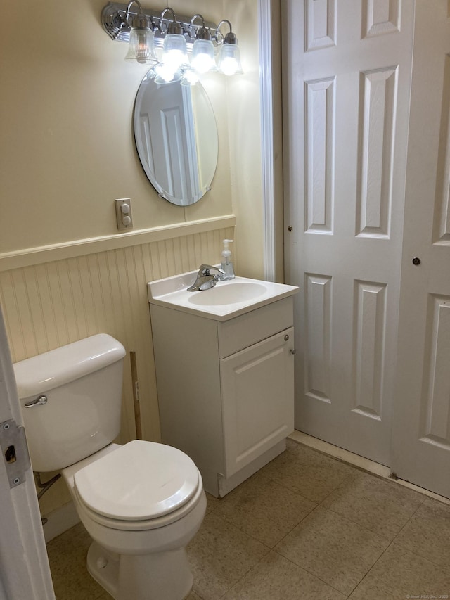21 Chicago Ave, Groton, CT 06340 - half bathroom featuring vanity and a wainscoted wall