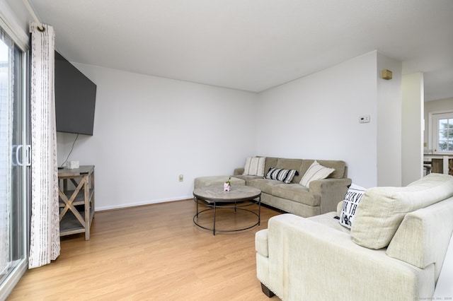 95 Elm St Apt 4, West Haven, CT 06516 - living room with light wood-style floors and baseboards