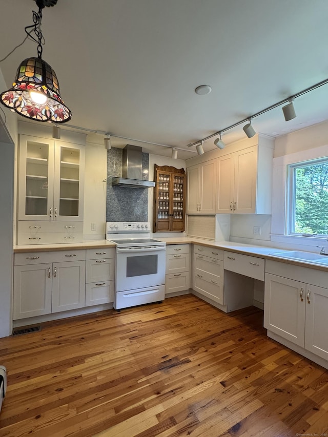 23 Mountain Rd, Mansfield, CT 06250 - kitchen with white electric range, wall chimney exhaust hood, rail lighting, and light wood-type flooring