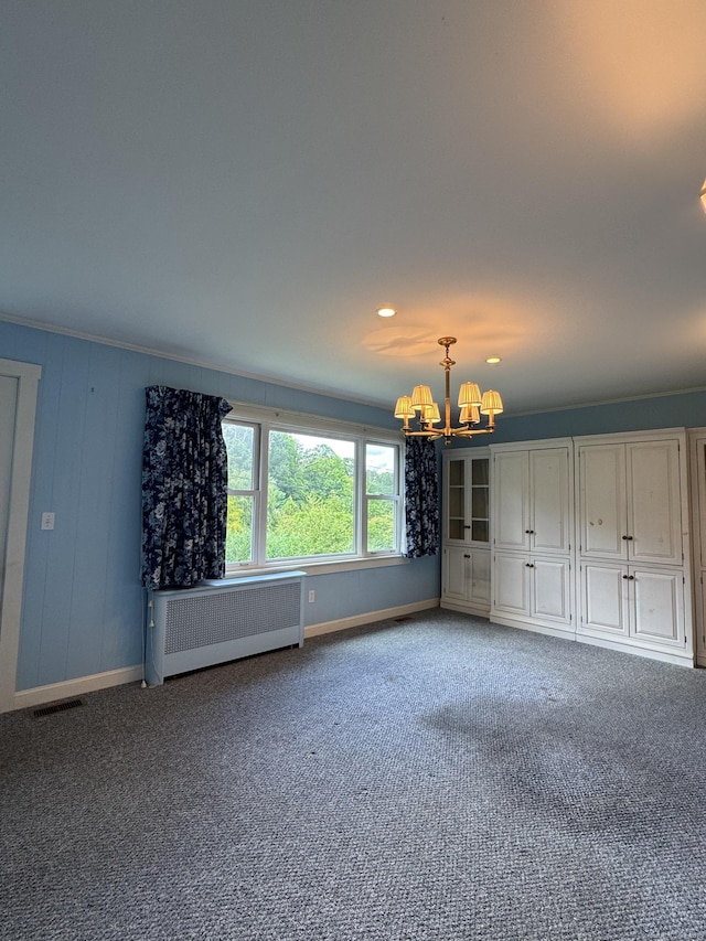 23 Mountain Rd, Mansfield, CT 06250 - unfurnished living room with radiator, a chandelier, and carpet flooring