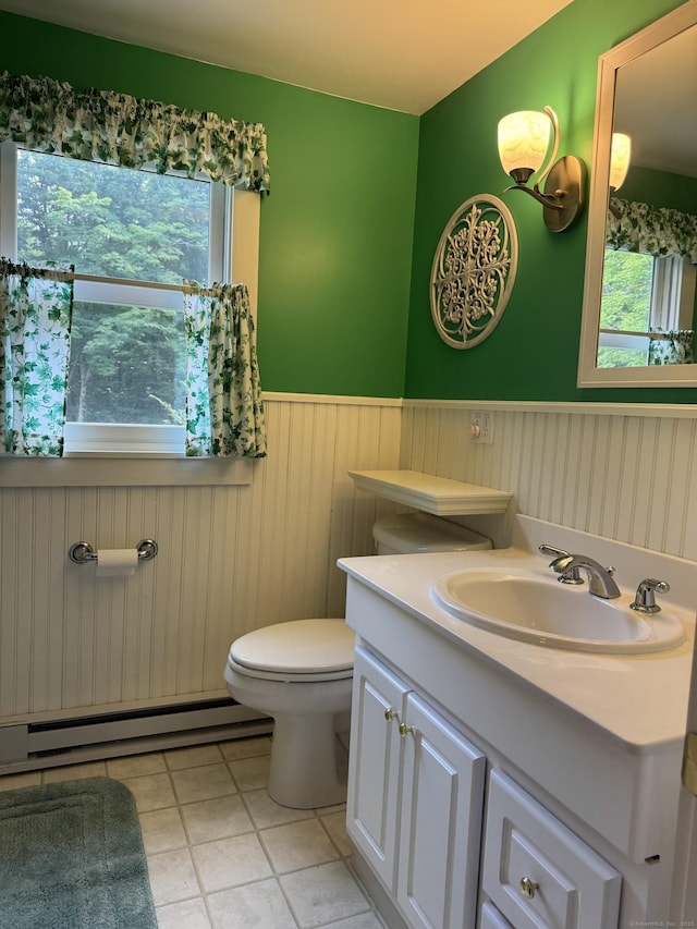 23 Mountain Rd, Mansfield, CT 06250 - bathroom featuring a baseboard heating unit, a wainscoted wall, vanity, plenty of natural light, and tile patterned flooring