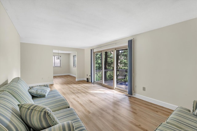 23 Happy Hollow Cir Unit B, Stratford, CT 06614 - living area featuring baseboards and light wood-type flooring