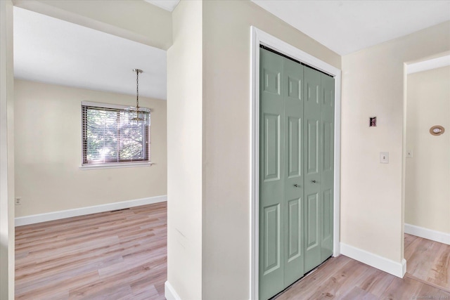 23 Happy Hollow Cir Unit B, Stratford, CT 06614 - hall with light wood-type flooring and a chandelier