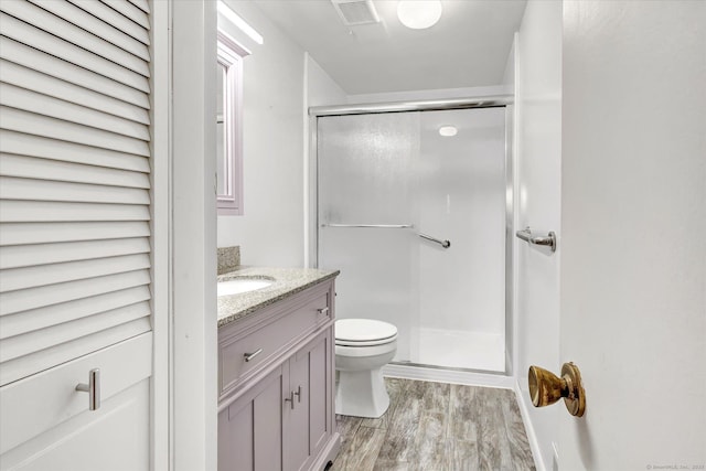23 Happy Hollow Cir Unit B, Stratford, CT 06614 - bathroom featuring wood finished floors, vanity, and a shower stall