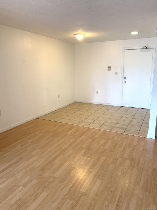 90 Kane St Apt C3, West Hartford, CT 06119 - empty room with light wood-style floors and a textured ceiling