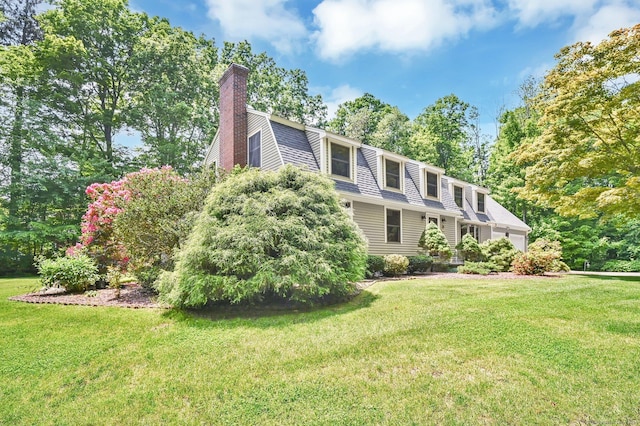 373 Broad Way, Coventry, CT 06238 - view of front of property featuring a chimney, a front yard, and view of scattered trees
