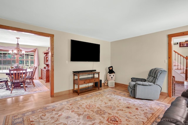 373 Broad Way, Coventry, CT 06238 - living area with a chandelier, stairs, and wood finished floors