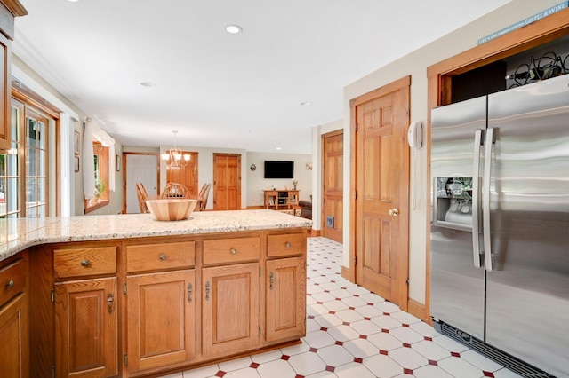 373 Broad Way, Coventry, CT 06238 - kitchen with stainless steel fridge with ice dispenser, light floors, a chandelier, light stone counters, and recessed lighting