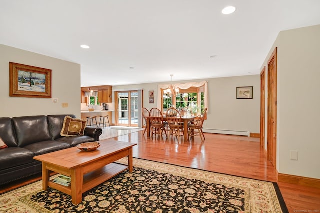 373 Broad Way, Coventry, CT 06238 - living area with light wood-type flooring, a baseboard heating unit, a chandelier, and recessed lighting