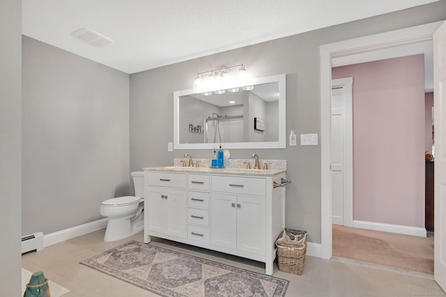 373 Broad Way, Coventry, CT 06238 - full bath with a baseboard radiator, double vanity, an enclosed shower, and tile patterned flooring