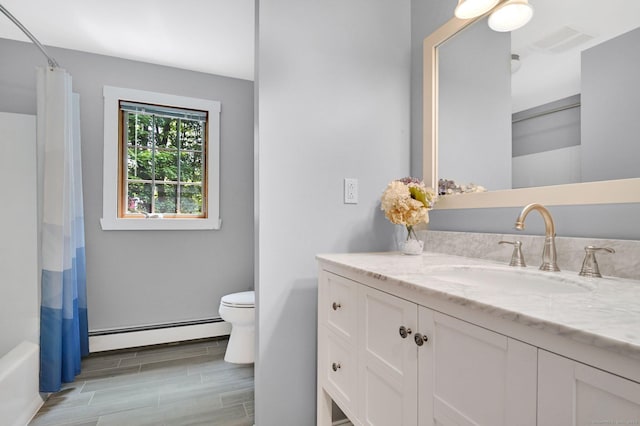 373 Broad Way, Coventry, CT 06238 - full bathroom featuring baseboard heating, vanity, wood tiled floors, and shower / tub combo with curtain