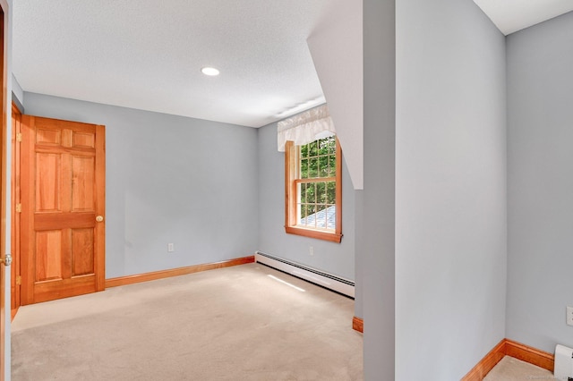 373 Broad Way, Coventry, CT 06238 - spare room with baseboard heating, carpet flooring, recessed lighting, and a baseboard heating unit