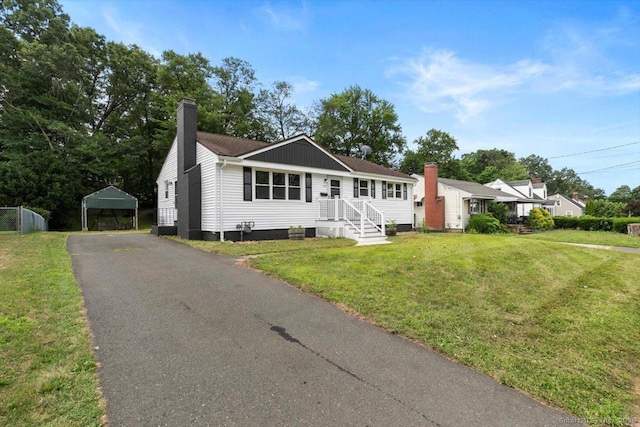 230 Green Rd, Manchester, CT 06042 - view of front of home with a chimney, a carport, and a front lawn