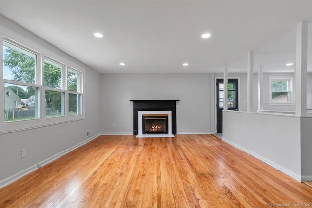 230 Green Rd, Manchester, CT 06042 - unfurnished living room featuring light wood-style floors, a fireplace with flush hearth, and recessed lighting