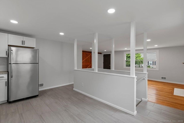 230 Green Rd, Manchester, CT 06042 - kitchen featuring freestanding refrigerator, light wood-style floors, recessed lighting, white cabinetry, and light countertops